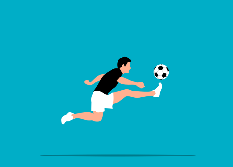 soccer player kicking ball